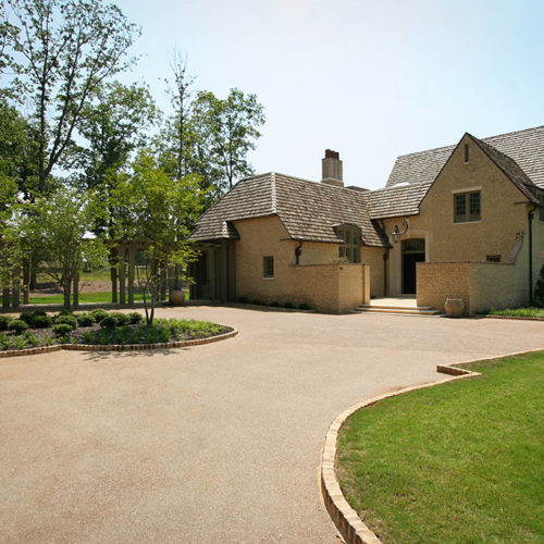 Driveway of Yellow Bricked Home